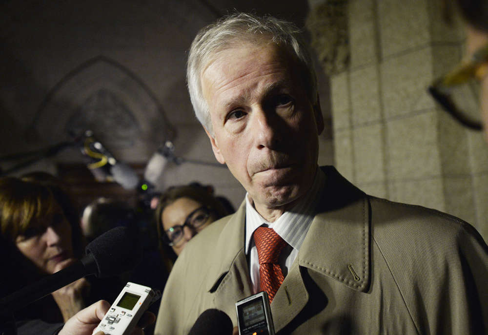 Foreign Affairs Minister Stephane Dion scrums with media in Ottawa on Tuesday, Dec. 8, 2015. iPolitics/Matthew Usherwood